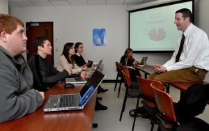 students listening to corporate presentation