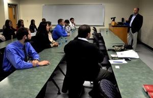 students listening to corporate presentation