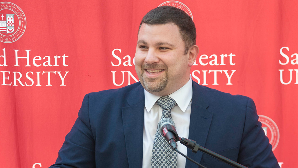Man speaking at microphone