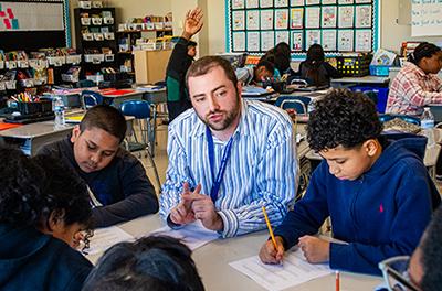 student teacher working with students