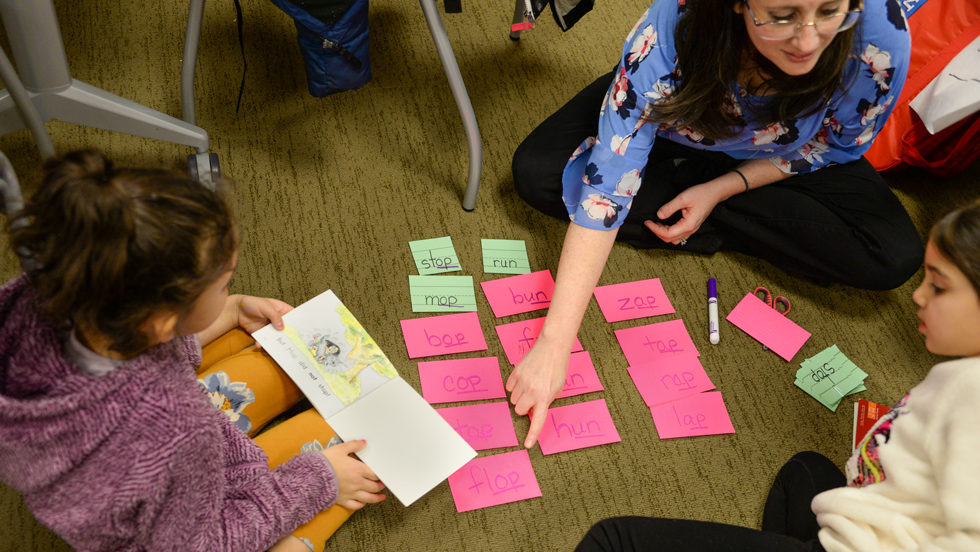 Teacher using flashcards with children