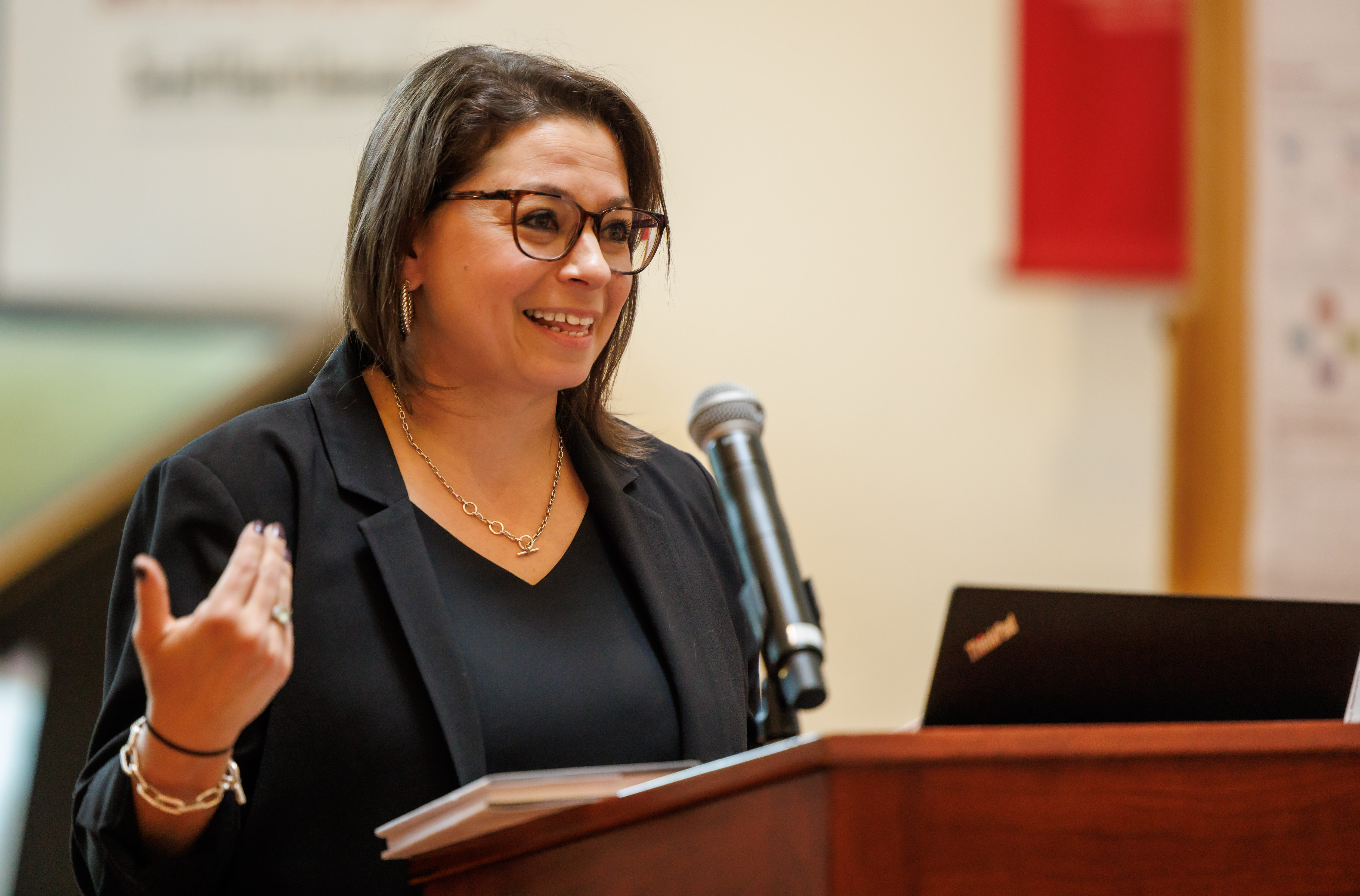 Woman presenting at podium