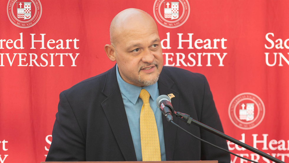 Man speaking into microphone