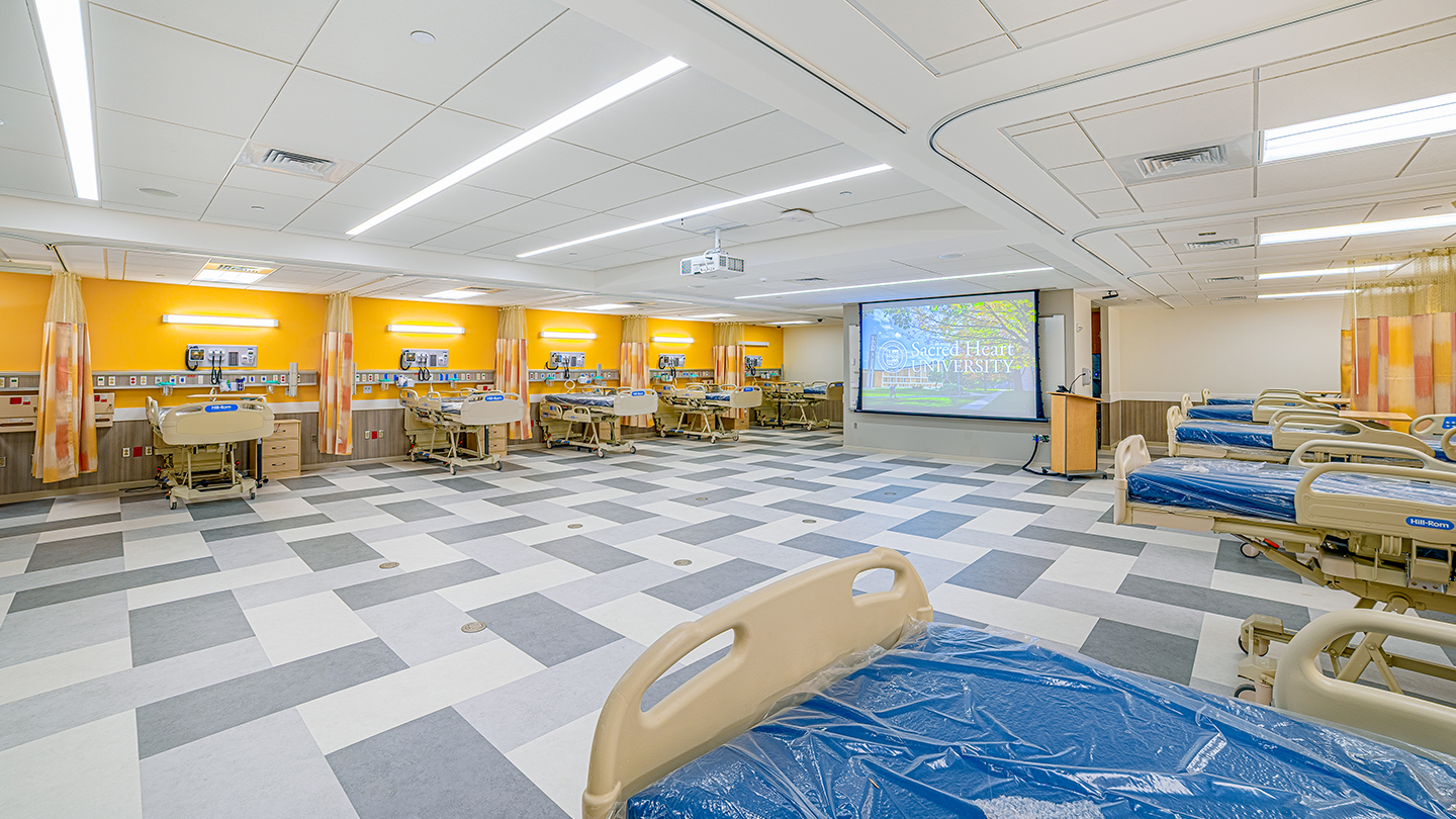 a nursing bedside care lab showing multiple bed stations