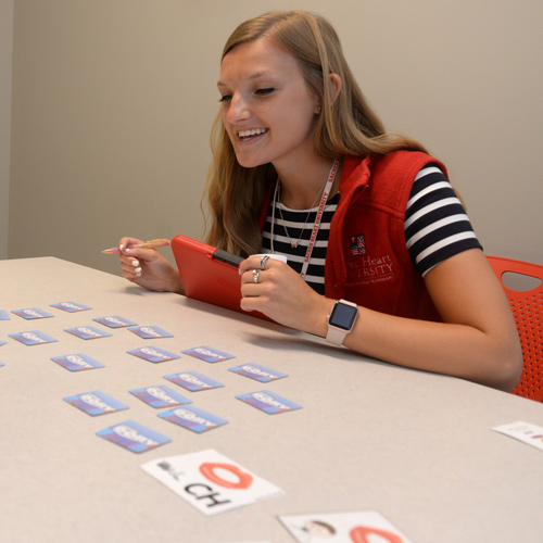 Speech-Language Pathology student using flashcards