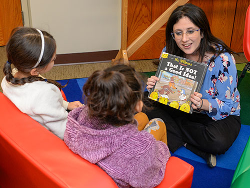 someone reading to children 