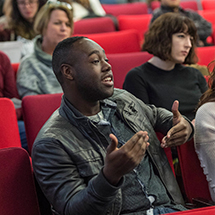 graduate students in a theatre