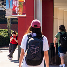 college students waiting for a campus shuttle