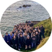 Students in front of water in Dingle