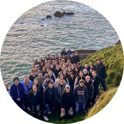 Students in front of water in Dingle