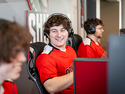 college students playing video games on computers