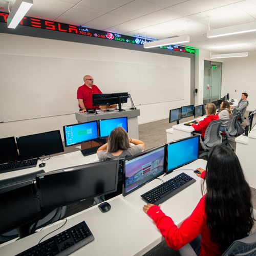 Classroom with professor and students with ticker tape terminals