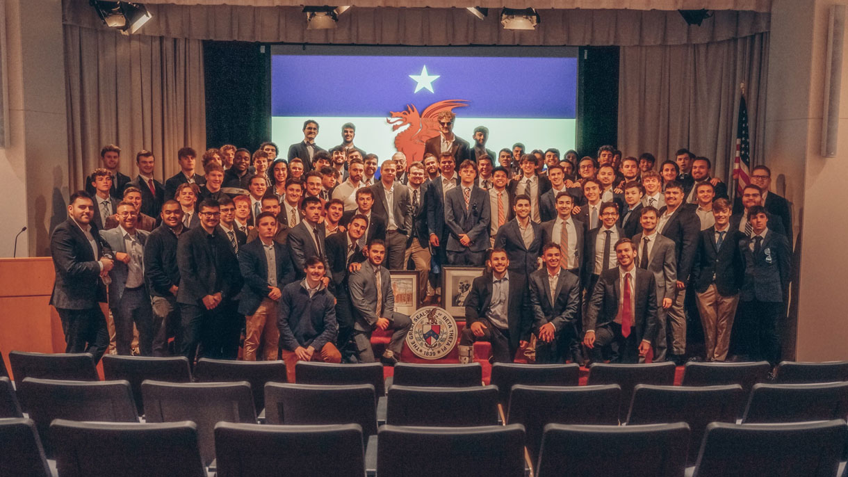 Members of Beta Theta Pi at brotherhood event. All dressed in suit jacket, tie, dress pants