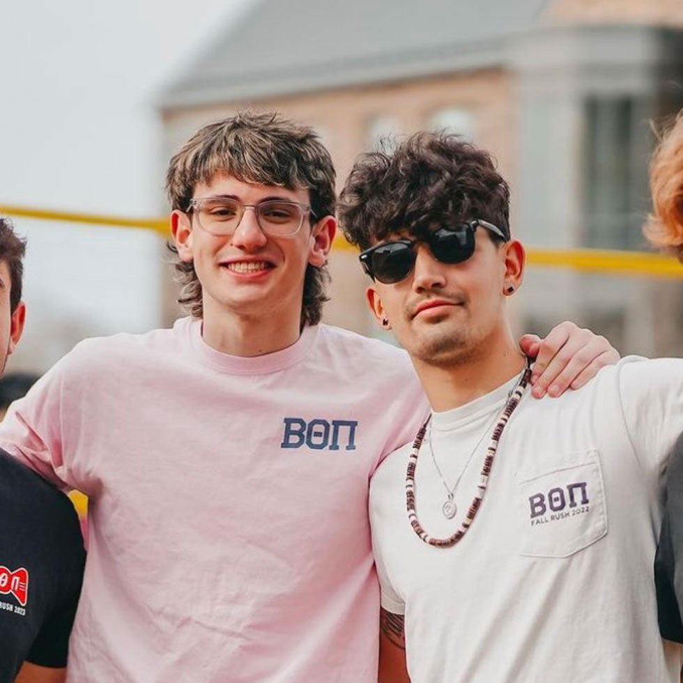 Members of Beta Theta Pi at a brotherhood event, smiling for a photo