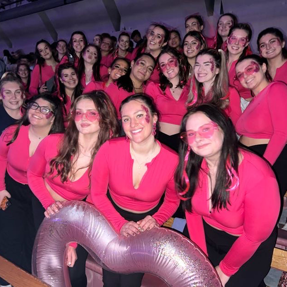 Members of Kappa Alpha Theta wearing pink at Greek Sing