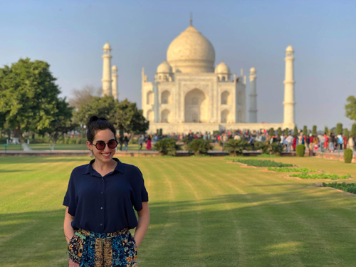Woman standing in front of building in India
