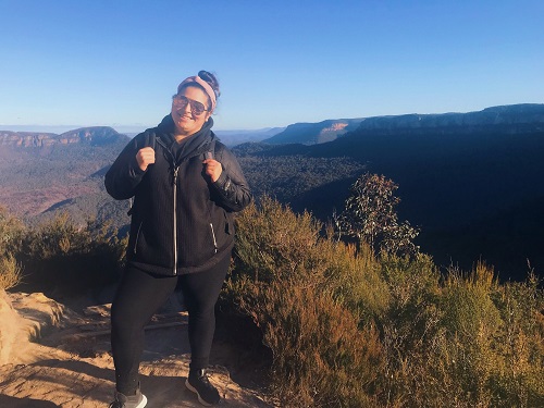 Woman with mountains in the back