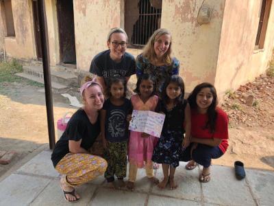 Four SHU students with three preschool students from India