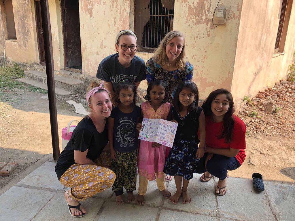 Four SHU students with three preschool students from India