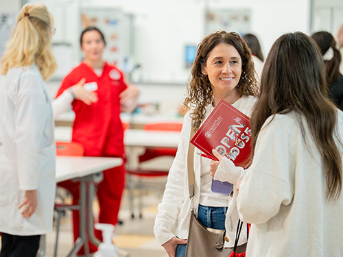 people at a college nursing open house
