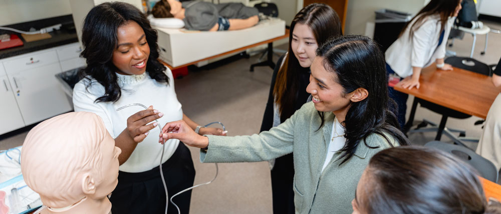 Students in PA program practicing with a oxygen tube