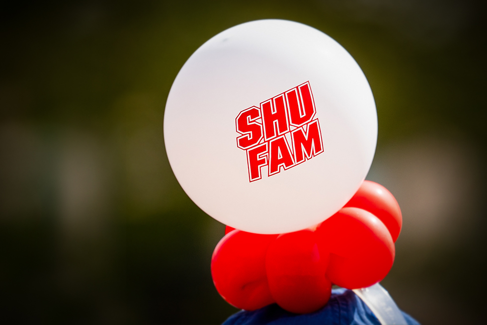 a white balloon that says SHU FAM