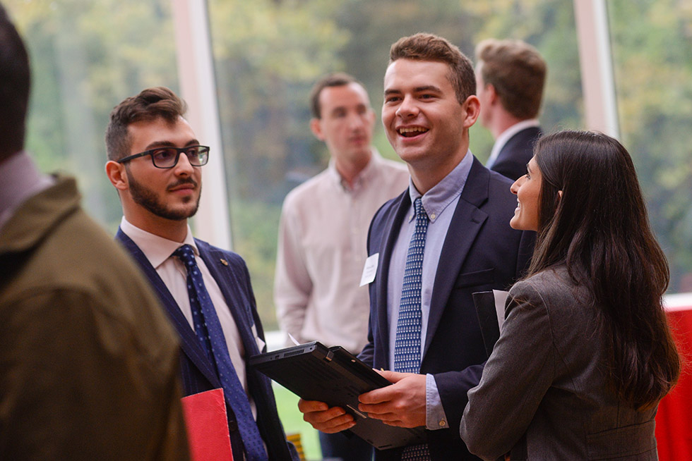 three business students talking