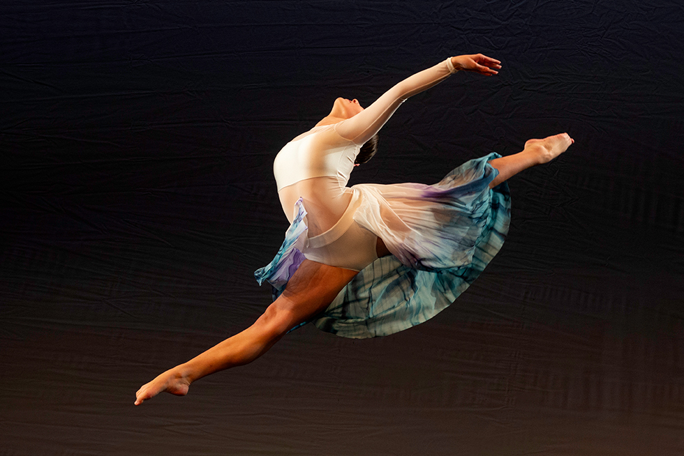 a dancer leaping midair