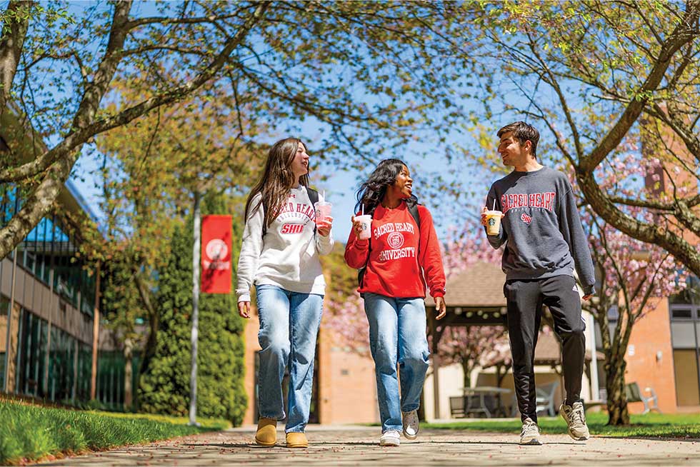 three people walking and talking