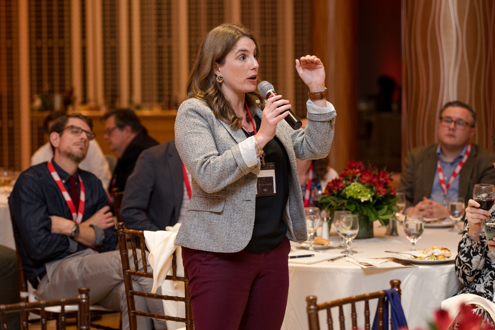 a person speaking at a conference