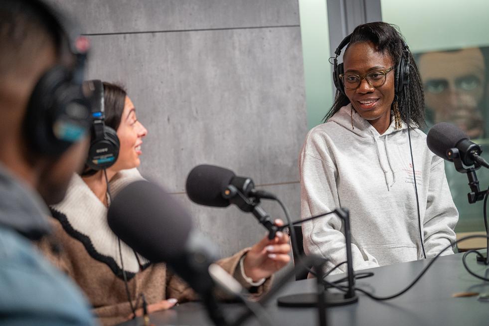 two people having a conversation in a podcast studio