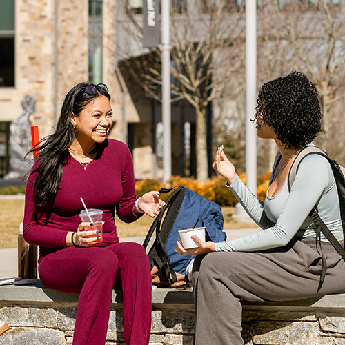 two college students talking outside