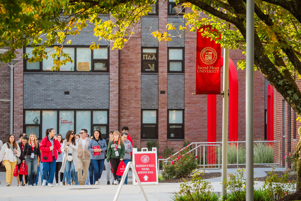people walking around on a campus tour at Sacred Heart University