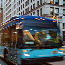 bus driving down a street