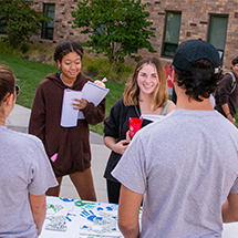 college students gathering information at an involvement fair