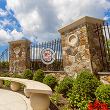 SHU seal on a decorative campus fence