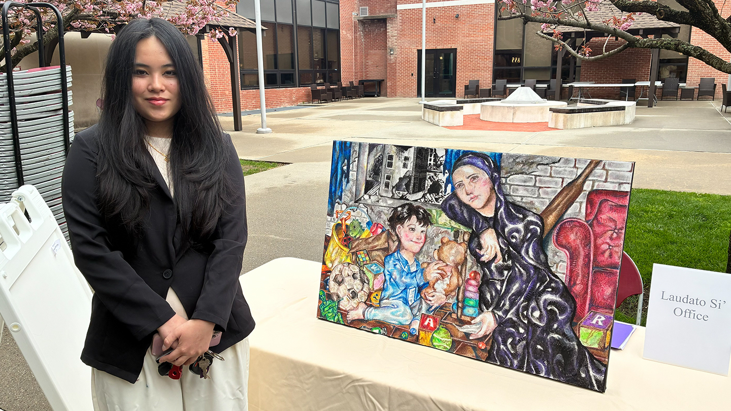 Maxin Liao with her painting