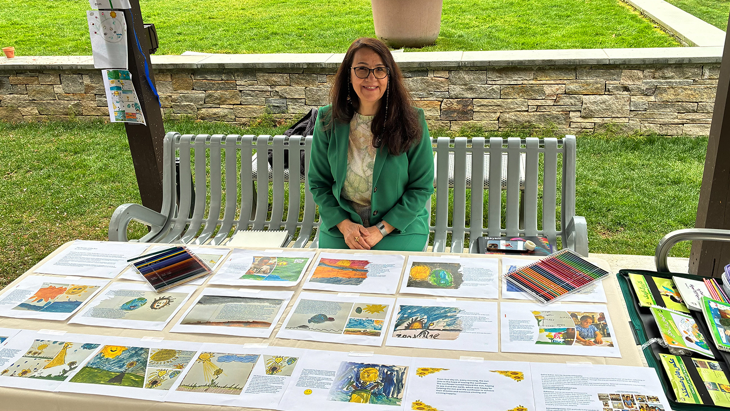 an artist shows off her artwork