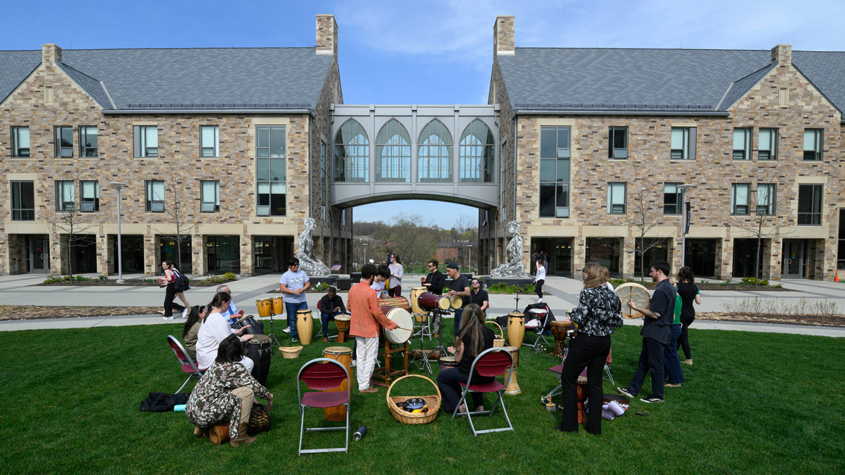 Drum circle on the Pioneer Village Upper Quad
