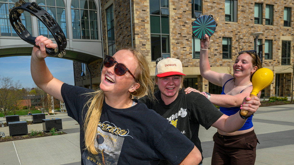 Students playing instruments outside
