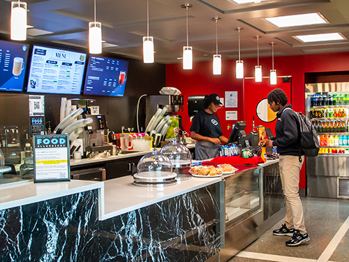 A person waiting in line at a cafe