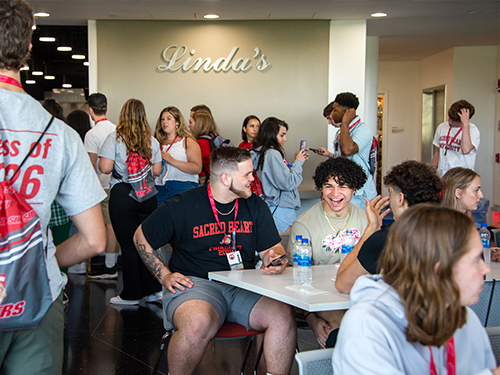 people laughing in a cafeteria
