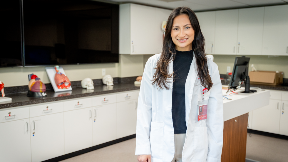 Medical student standing in classroom