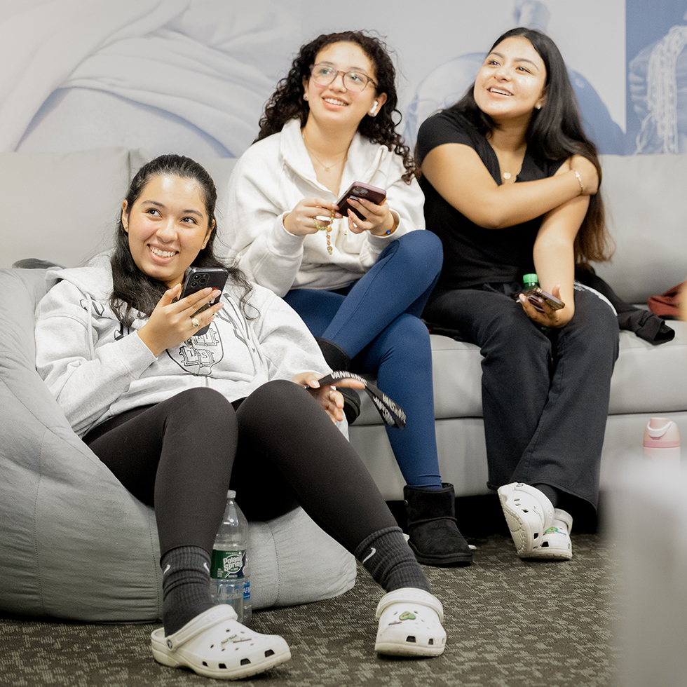 three people smiling