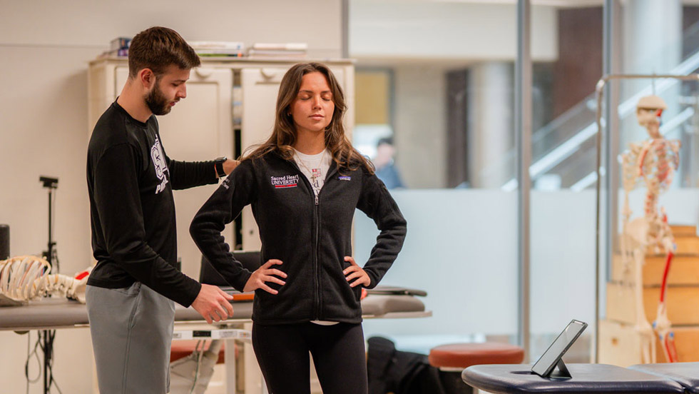 Physical therapist working with patient