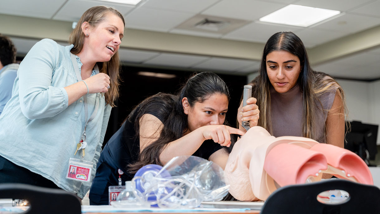 Students learning on mannequin