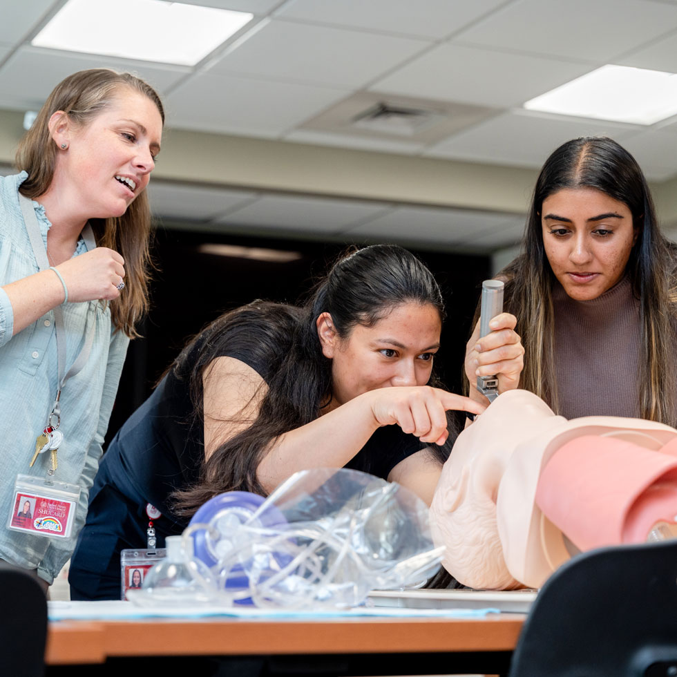 Students learning on mannequin