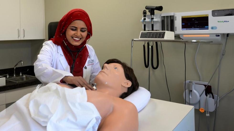 Physician Assistant student listen to manikins heartbeat