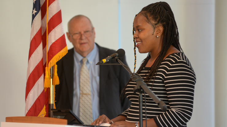 Someone speaking at a podium