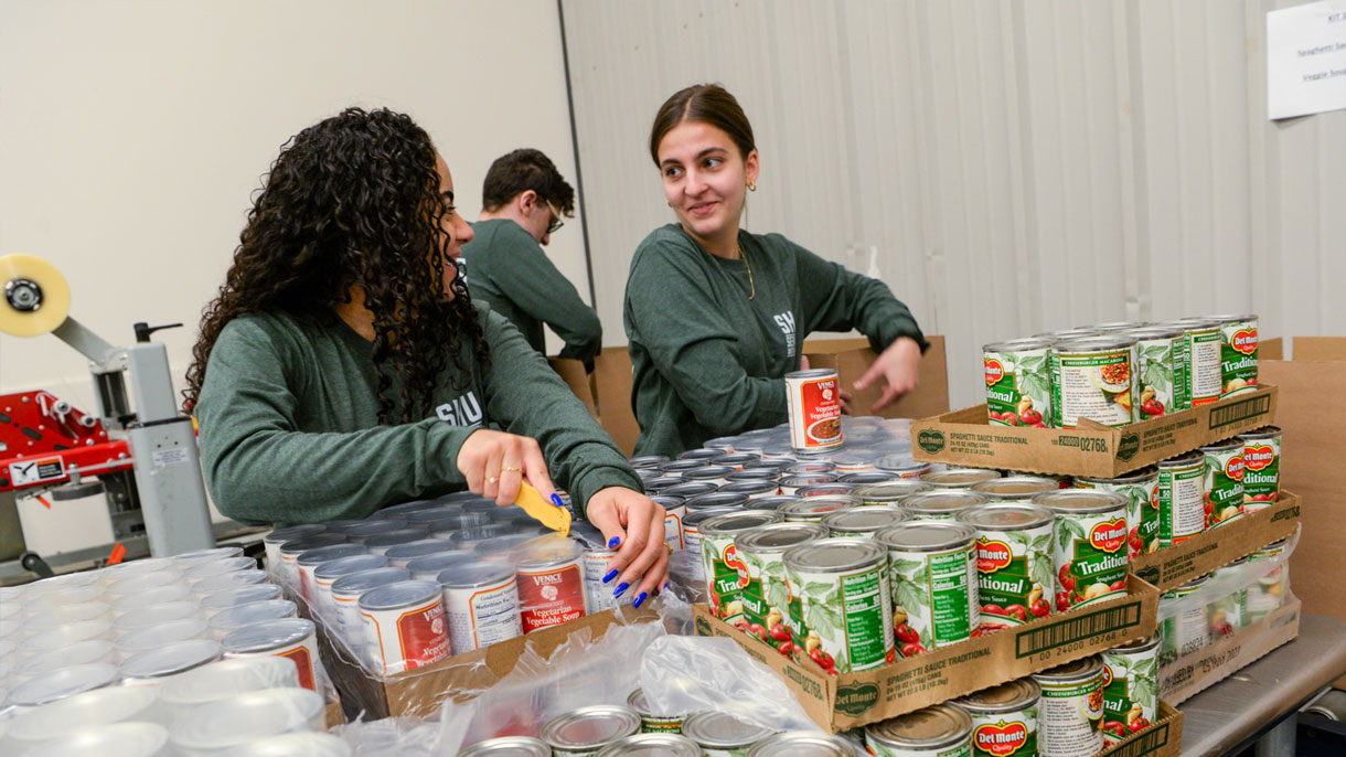 Students packing food donations